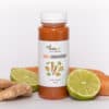 Flesje 100% oranje groentensap van Zuss & Sap met ingrediënten erbij